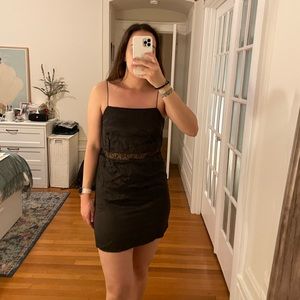 Black satin dress with lace middle cut